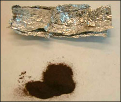 image of aluminum foil containing 1.0 grams of TNT, a high explosive.