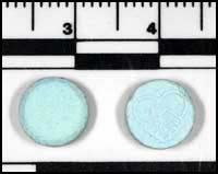 photo-blue tablets with a "handshake" logo on one side, suspected ecstasy