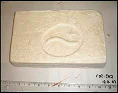 photo-brick with unusual logo consisting of a wavey line with a five-pointed star above and to the right of the wave