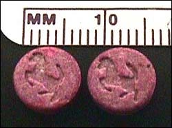 red colored tablets with the "Ferrari" logo imprinted on each 