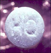 blue/green colored tablets, respectively, with an "HO" or "OH" logo, suspected Ecstas